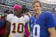 Oct 21, 2012; East Rutherford, NJ, USA; New York Giants quarterback Eli Manning (10) (right) meets Washington Redskins quarterback Robert Griffin III (10) (left) after the New York Giants 27-23, come-from-behind win over the Washington Redskins at MetLife Stadium. Mandatory Credit: Andrew Mills/THE STAR-LEDGER via USA TODAY Sports