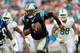 MIAMI GARDENS, FL - NOVEMBER 24: Cam Newton #1 of the Carolina Panthers runs the ball in the second quarter against the Miami Dolphins at Sun Life Stadium on November 24, 2013 in Miami Gardens, Florida. (Photo by Chris Trotman/Getty Images)