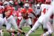 COLUMBUS, OH - NOVEMBER 23: Carlos Hyde #34 of the Ohio State Buckeyes looks for running room in the first quarter against the Indiana Hoosiers at Ohio Stadium on November 23, 2013 in Columbus, Ohio. Ohio State defeated Indiana 42-14. (Photo by Jamie Sabau/Getty Images)