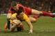 CARDIFF, WALES - NOVEMBER 30: Israel Folau of Australia is tackled by Scott Williams during the international match between Wales and Australia at the Millennium Stadium on November 30, 2013 in Cardiff, Wales. (Photo by David Rogers/Getty Images)