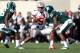 EAST LANSING, MI - SEPTEMBER 29: Braxton Miller #5 of the Ohio State Buckeyes looks for running room between Darqueze Dennard #31 and RJ Williamson #26 of the Michigan State Spartans at Spartan Stadium on September 29, 2012 in East Lansing, Michigan. (Photo by Gregory Shamus/Getty Images)