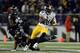 BALTIMORE, MD - NOVEMBER 28: Le'Veon Bell #26 of the Pittsburgh Steelers avoids the tackle of Terrell Suggs #55 of the Baltimore Ravens in the second half of an NFL game at M&T Bank Stadium on November 28, 2013 in Baltimore, Maryland. (Photo by Patrick Smith/Getty Images)
