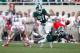 EAST LANSING, MI - SEPTEMBER 29: Isaiah Lewis #9 of the Michigan State Spartans dives for a fourth quarter interception in front of teammate Darqueze Dennard #31 and Jake Stoneburner #11 of the Ohio State Buckeyes of the Michigan State Spartans at Spartan Stadium on September 29, 2012 in East Lansing, Michigan. Ohio State won the game 17-16. (Photo by Gregory Shamus/Getty Images)