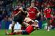 EDINBURGH, SCOTLAND - OCTOBER 12: James Downey of Munster tackles Jack Cuthbert of Edinburgh during the Heineken Cup Pool 6 Match between Edinburgh and Munster at Murrayfield Stadium, on October 12, 2013 in Edinburgh, Scotland. (Photo by Ian MacNicol/Getty Images)