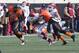 Dec 7, 2013; Stillwater, OK, USA; Oklahoma Sooners quarterback Trevor Knight (9) runs for yardage during the first quarter against Oklahoma State Cowboys linebacker Shaun Lewis (11) at Boone Pickens Stadium. Mandatory Credit: Richard Rowe-USA TODAY Sports