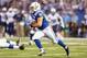 INDIANAPOLIS, IN - DECEMBER 01: Donald Brown #31 of the Indianapolis Colts runs with the ball during the NFL game against the Tennessee Titans at Lucas Oil Stadium on December 1, 2013 in Indianapolis, Indiana. (Photo by Andy Lyons/Getty Images)