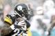 Dec 8, 2013; Pittsburgh, PA, USA; Pittsburgh Steelers running back Le'Veon Bell (26) runs after a pass reception against the Miami Dolphins during the first quarter at Heinz Field. Mandatory Credit: Charles LeClaire-USA TODAY Sports