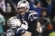 Dec 8, 2013; Foxborough, MA, USA; New England Patriots quarterback Tom Brady (12) leaps into the arms of center Ryan Wendell (62) after he threw the winning touchdown pass during the fourth quarter of New England's 27-26 win over the Cleveland Browns at Gillette Stadium. Mandatory Credit: Winslow Townson-USA TODAY Sports