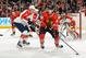 CHICAGO, IL - DECEMBER 8: Patrick Kane #88 of the Chicago Blackhawks grabs the puck as Dmitry Kulikov #7 of the Florida Panthers approaches from behind during the NHL game on December 08, 2013 at the United Center in Chicago, Illinois. (Photo by Bill Smith/NHLI via Getty Images)
