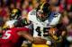 LINCOLN, NE - NOVEMBER 29: Fullback Mark Weisman #45 of the Iowa Hawkeyes runs through linebacker Michael Rose #15 of the Nebraska Cornhuskers during their game at Memorial stadium on November 29, 2013 in Lincoln, Nebraska. (Photo by Eric Francis/Getty Images)