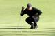 Woods lines up a putt at the Northwestern Mutual World Challenge.