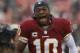 Dec 8, 2013; Landover, MD, USA; Washington Redskins quarterback Robert Griffin III (10) runs onto the field prior to the game against the Kansas City Chiefs at FedEx Field. Mandatory Credit: Geoff Burke-USA TODAY Sports