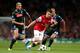 LONDON, ENGLAND - OCTOBER 01: Aaron Ramsey of Arsenal is pursued by Valon Behrami (L) and Gokhan Inler (R) of Napoli during UEFA Champions League Group F match between Arsenal FC and SSC Napoli at Emirates Stadium on October 1, 2013 in London, England. (Photo by Paul Gilham/Getty Images)