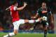 LONDON, ENGLAND - OCTOBER 01: Olivier Giroud of Arsenal and Gokhan Inler of Napoli compete for the ball during UEFA Champions League Group F match between Arsenal FC and SSC Napoli at Emirates Stadium on October 1, 2013 in London, England. (Photo by Paul Gilham/Getty Images)