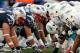 Oct 27, 2013; Foxborough, MA, USA; The New England Patriots and the Miami Dolphins line up at the line of scrimmage before the snap during the second quarter at Gillette Stadium. Mandatory Credit: Winslow Townson-USA TODAY Sports
