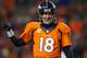 DENVER, CO - DECEMBER 8: Quarterback Peyton Manning #18 of the Denver Broncos celebrates a 20 yard fourth quarter touchdown pass to Eric Decker #87 (not pictured) during a game against the Tennessee Titans at Sports Authority Field Field at Mile High on December 8, 2013 in Denver, Colorado. (Photo by Dustin Bradford/Getty Images)