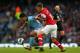 MANCHESTER, ENGLAND - SEPTEMBER 23: Sergio Aguero of Manchester City is put under pressure by Aaron Ramsey of Arsenal during the Barclays Premier League match between Manchester City and Arsenal at Etihad Stadium on September 23, 2012 in Manchester, England. (Photo by Alex Livesey/Getty Images)