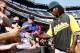 Former Oakland Athletic Jemile Weeks signs autographs for fans.