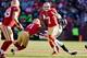 SAN FRANCISCO, CA - DECEMBER 08: Quarterback Colin Kaepernick of the San Francisco 49ers evades a rush by cornerback Richard Sherman