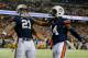 ATLANTA, GA - DECEMBER 07: Tre Mason #21 of the Auburn Tigers celebrates his fourth quarter touchdown with teammate quarterback Nick Marshall #14 against the Missouri Tigers during the SEC Championship Game at Georgia Dome on December 7, 2013 in Atlanta, Georgia. (Photo by Kevin C. Cox/Getty Images)