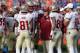 Nov 30, 2013; Gainesville, FL, USA; Florida State Seminoles head coach Jimbo Fisher talks with quarterback Jameis Winston (5) against the Florida Gators during the second half at Ben Hill Griffin Stadium. Florida State Seminoles defeated the Florida Gators 37-7. Mandatory Credit: Kim Klement-USA TODAY Sports