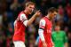 MANCHESTER, ENGLAND - DECEMBER 14: Per Mertesacker of Arsenal has words with Mesut Oezil of Arsenal during the Barclays Premier League match between Manchester City and Arsenal at Etihad Stadium on December 14, 2013 in Manchester, England. (Photo by Richard Heathcote/Getty Images)