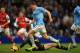 MANCHESTER, ENGLAND - DECEMBER 14: James Milner of Manchester City is brought down for a penalty by Wojciech Szczesny of Arsenal during the Barclays Premier League match between Manchester City and Arsenal at Etihad Stadium on December 14, 2013 in Manchester, England. (Photo by Richard Heathcote/Getty Images)