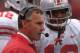 MADISON, WI - OCTOBER 19: Running back Maurice Clarett #13 of the Ohio State Buckeyes listens to head coach Jim Tressel during the Big Ten Conference football game against the Wisconsin Badgers at Camp Randall Stadium on October 19, 2002 in Madison, Wisconsin. The Buckeyes won 19-14. (Photo by Jonathan Daniel/Getty Images)