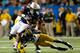 ATLANTA, GA - DECEMBER 07: Tre Mason #21 of the Auburn Tigers is upended by Ian Simon #21 of the Missouri Tigers during the SEC Championship Game at Georgia Dome on December 7, 2013 in Atlanta, Georgia. (Photo by Kevin C. Cox/Getty Images)
