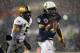 Dec 14, 2013; Philadelphia, PA, USA; Navy Midshipmen quarterback Keenan Reynolds (19) runs past Army Black Knights linebacker Justin Trimble (5) for a touchdown during the first half at Lincoln Financial Field. Mandatory Credit: Danny Wild-USA TODAY Sports