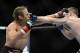 December 14, 2013; Sacramento, CA, USA; Urijah Faber (red gloves) fights Michael McDonald (blue gloves) during the bantamweight bout of the UFC on FOX 9 at Sleep Train Arena. Mandatory Credit: Kyle Terada-USA TODAY Sports