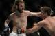 December 14, 2013; Sacramento, CA, USA; Sam Stout (red gloves) fights Cody McKenzie (blue gloves) during the lightweight bout of the UFC on FOX 9 at Sleep Train Arena. Mandatory Credit: Kyle Terada-USA TODAY Sports