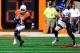 AUSTIN, TX - NOVEMBER 02: Justin McKay #19 of the Kansas Jayhawks pursues Daje Johnson #4 of the Texas Longhorns during a game at Darrell K Royal-Texas Memorial Stadium on November 2, 2013 in Austin, Texas. Texas won the game 35-13. (Photo by Stacy Revere/Getty Images)
