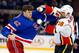 NEW YORK, NY - DECEMBER 15: Brian McGrattan #16 of the Calgary Flames throws a punch at Dylan McIlrath #42 of the New York Rangers during their second period fight at Madison Square Garden on December 15, 2013 in New York City. (Photo by Jim McIsaac/Getty Images)