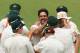 PERTH, AUSTRALIA - DECEMBER 17: Mitchell Johnson of Australia celebrates with Chris Rogers after the combined to dismiss Tim Bresnan of England during day five of the Third Ashes Test Match between Australia and England at WACA on December 17, 2013 in Perth, Australia. (Photo by Robert Cianflone/Getty Images)