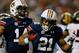 ATLANTA, GA - DECEMBER 07: Tre Mason #21 of the Auburn Tigers celebrates his second quarter touchdown with teammate quarterback Nick Marshall #14 against the Missouri Tigers during the SEC Championship Game at Georgia Dome on December 7, 2013 in Atlanta, Georgia. (Photo by Kevin C. Cox/Getty Images)