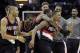 Dec 17, 2013; Cleveland, OH, USA; Portland Trail Blazers point guard Damian Lillard (front right) is swarmed by his teammates after making a game-winning, three-point basket against the Cleveland Cavaliers at Quicken Loans Arena. Mandatory Credit: David Richard-USA TODAY Sports