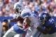 EAST RUTHERFORD, NJ - OCTOBER 17: Kevin Smith #34 of the Detroit Lions is tackled by Jonathan Goff #54 of the New York Giants at New Meadowlands Stadium on October 17, 2010 in East Rutherford, New Jersey. (Photo by Nick Laham/Getty Images)