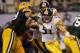 ARLINGTON, TX - FEBRUARY 06: James Farrior #51 of the Pittsburgh Steelers rushes in on Daryn Colledge #73 of the Green Bay Packers during Super Bowl XLV at Cowboys Stadium on February 6, 2011 in Arlington, Texas. (Photo by Doug Pensinger/Getty Images)