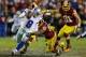 LANDOVER, MD - DECEMBER 30: Tony Romo #9 of the Dallas Cowboys tries to avoid the tackle of London Fletcher #59 of the Washington Redskins in the fourth quarter at FedExField on December 30, 2012 in Landover, Maryland. (Photo by Rob Carr/Getty Images)