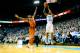 CHAPEL HILL, NC - DECEMBER 18: Leslie McDonald #2 of the North Carolina Tar Heels launches a 3-point shot over Isaiah Taylor #1 of the Texas Longhorns during their game at the Dean Smith Center on December 18, 2013 in Chapel Hill, North Carolina. Texas won 86-83. (Photo by Grant Halverson/Getty Images)