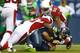 SEATTLE - DECEMBER 22: Russell Wilson #3 of the Seattle Seahawks is sacked by Javier Arenas #35 of the Arizona Cardinals on December 22, 2013 at CenturyLink Field in Seattle, Washington. (Photo by Jonathan Ferrey/Getty Images)