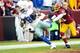 LANDOVER, MD - DECEMBER 22: Dez Bryant #88 of the Dallas Cowboys catches a touchdown in the second quarter against the Washington Redskins at FedExField on December 22, 2013 in Landover, Maryland. (Photo by Greg Fiume/Getty Images)