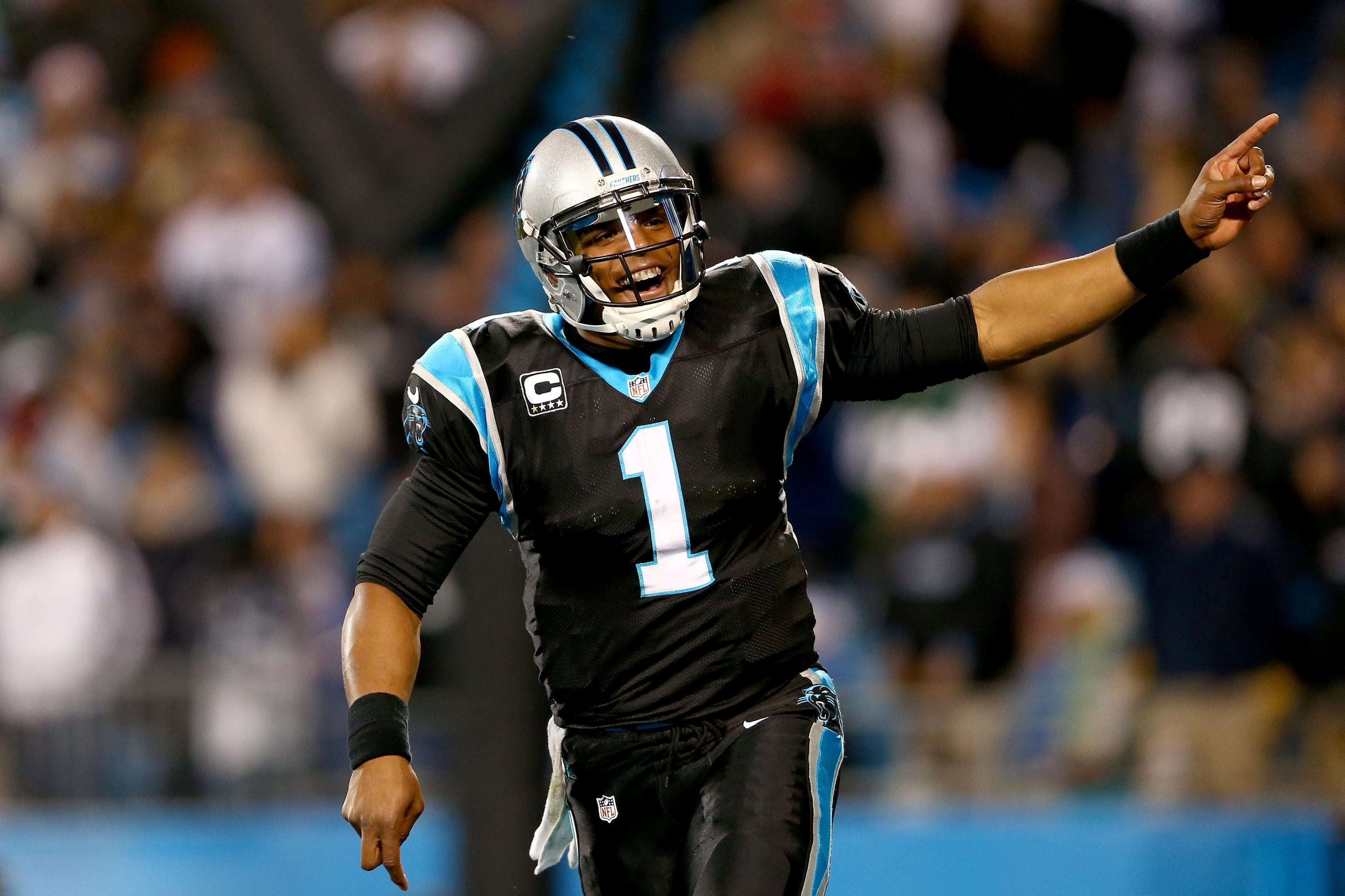 Cam Newton celebrates on Panthers logo after amazing TD run