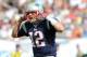 Dec 15, 2013; Miami Gardens, FL, USA; New England Patriots quarterback Tom Brady (12) yells out from the line of scrimmage during the first half against the Miami Dolphins at Sun Life Stadium. Mandatory Credit: Steve Mitchell-USA TODAY Sports