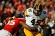 LINCOLN, NE - NOVEMBER 29: Fullback Mark Weisman #45 of the Iowa Hawkeyes runs through linebacker Michael Rose #15 of the Nebraska Cornhuskers during their game at Memorial stadium on November 29, 2013 in Lincoln, Nebraska. (Photo by Eric Francis/Getty Images)
