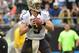 Dec 22, 2013; Charlotte, NC, USA; New Orleans Saints quarterback Drew Brees (9) looks to pass in the second quarter at Bank of America Stadium. Mandatory Credit: Bob Donnan-USA TODAY Sports
