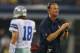 ARLINGTON, TX - AUGUST 24: Head coach Jason Garrett of the Dallas Cowboys on the field as Kyle Orton #18 walks past during a preseason game at AT&T Stadium on August 24, 2013 in Arlington, Texas. (Photo by Ronald Martinez/Getty Images)