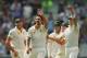 MELBOURNE, AUSTRALIA - DECEMBER 26: Ryan Harris (L) and Peter Siddle (R) congratulate Mitchell Johnson of Australia after he dismissed Jonny Bairstow of England during day one of the Fourth Ashes Test Match between Australia and England at Melbourne Cricket Ground on December 26, 2013 in Melbourne, Australia. (Photo by Scott Barbour/Getty Images)