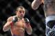 Feb 2, 2013; Las Vegas, NV, USA; Gleison Tibau (left) and Evan Dunham (right) during UFC 156 at the Mandalay Bay Events Center. Mandatory Credit: Gary A. Vasquez-USA TODAY Sports
